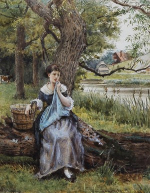 A girl sitting by the lake